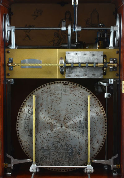 Interior of Regina Honduran mahogany Corona disc changer music box, circa 1890